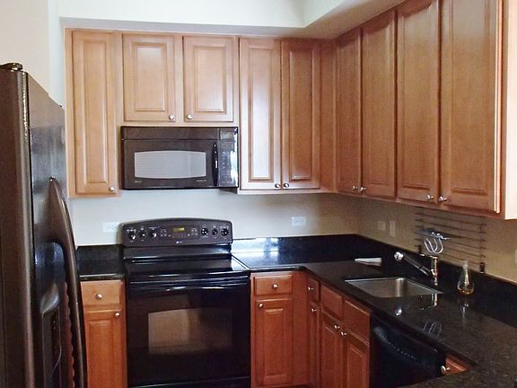 Kitchen with lots of cabinet space, granite counters and a b