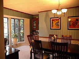 The dinning room has a dry bar and there is plenty of wall space for a buffet.