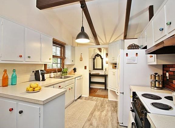 Lovely kitchen with generous cabinet and counter space.