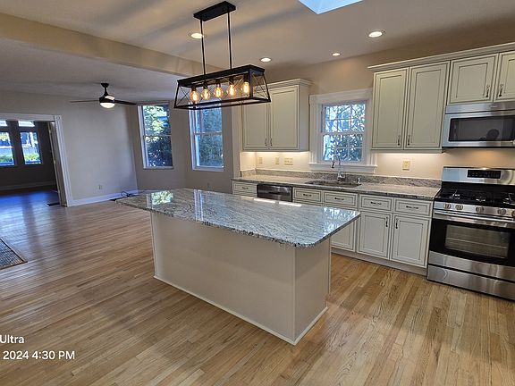 Kitchen view of Living Room and 3 Bedroom