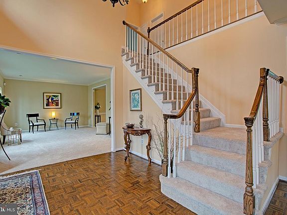 Elegant turned staircase and 2 story foyer
