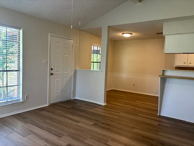Entry door to Unit B and Dining beyond.