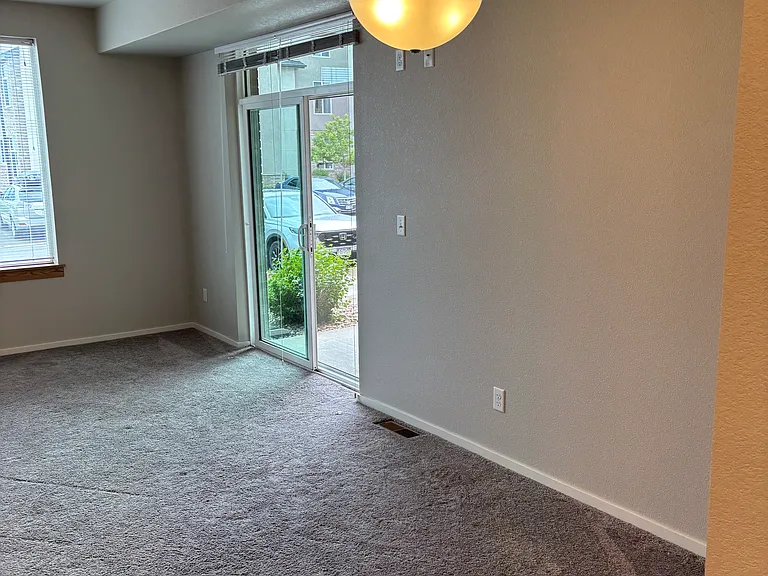 Ample space for a dining room table under the chandelier.