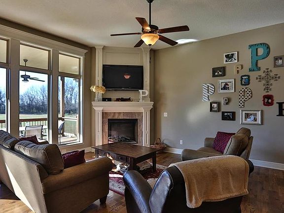 Great Room has tall ceilings & windows.