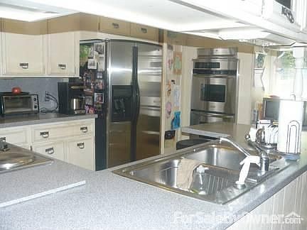 Kitchen, stainless steel appliances,coriann counter tops.