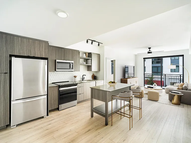 Sleek appliances, warm wood tones, and an airy layout bring everyday ease to life at your new home in Coral Springs, Florida.