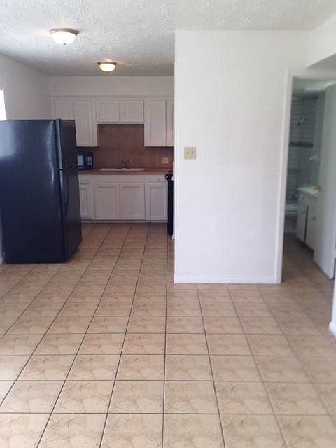 Picture taken from living room looking at kitchen and a glimpse of the bathroom.