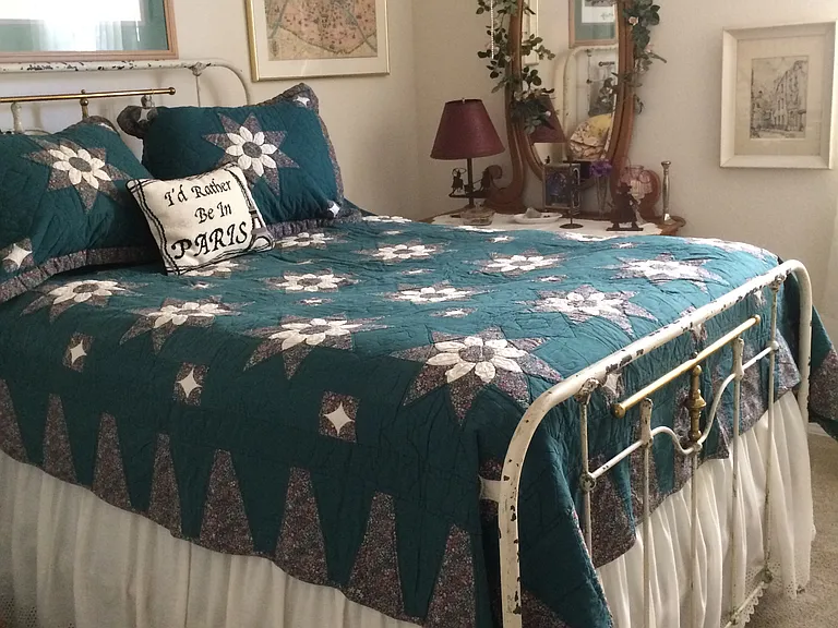 3rd bedroom with dresser and large closet. Double antique bed