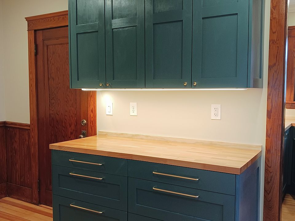 Undercabinet lighting and crown molding provides a feeling of luxury.