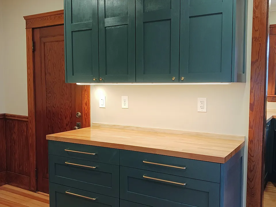 Undercabinet lighting and crown molding provides a feeling of luxury.