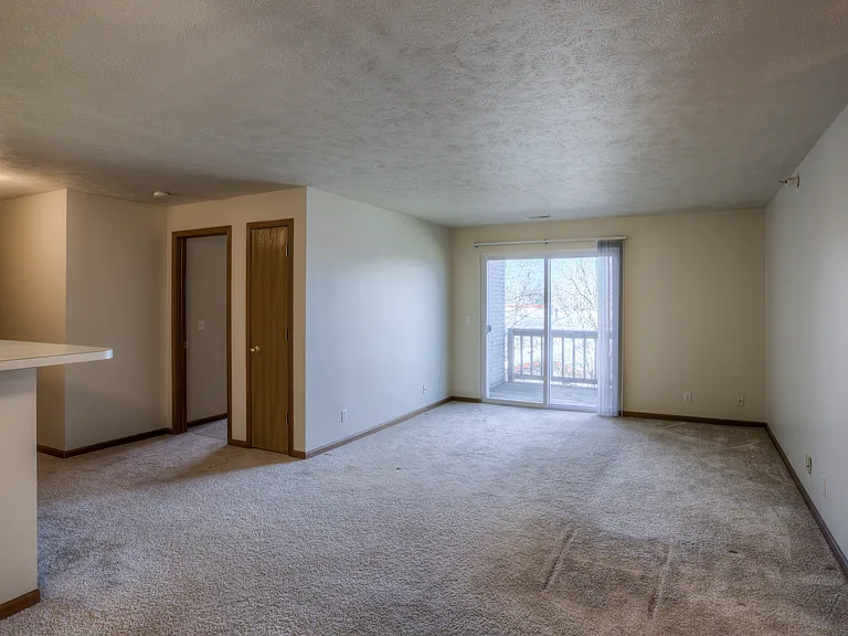 Carpet in living room at Huntington Apartments.