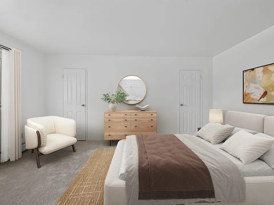 Step into tranquility at Eagle Rock Apartments at Patchogue Preserve. This beautifully designed bedroom showcases a serene palette and modern furnishings, creating the perfect retreat. Explore your new home today!