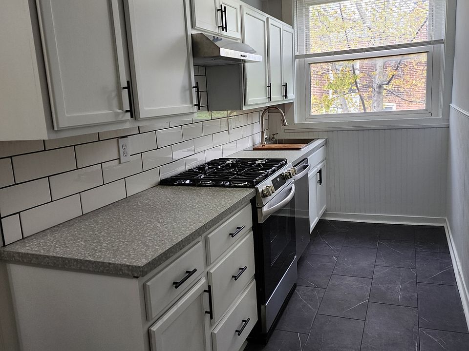 One side of the kitchen with new appliances including dishwasher