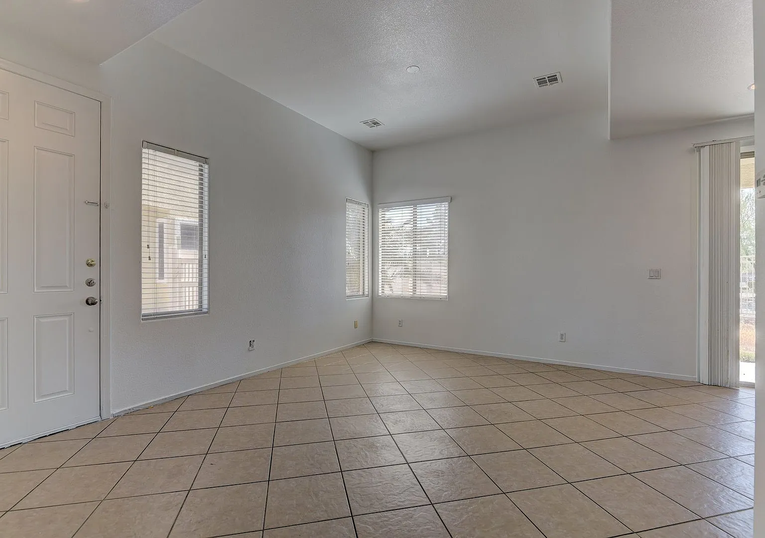 Elegant tile flooring extends throughout the entire downstairs area — Photo 4