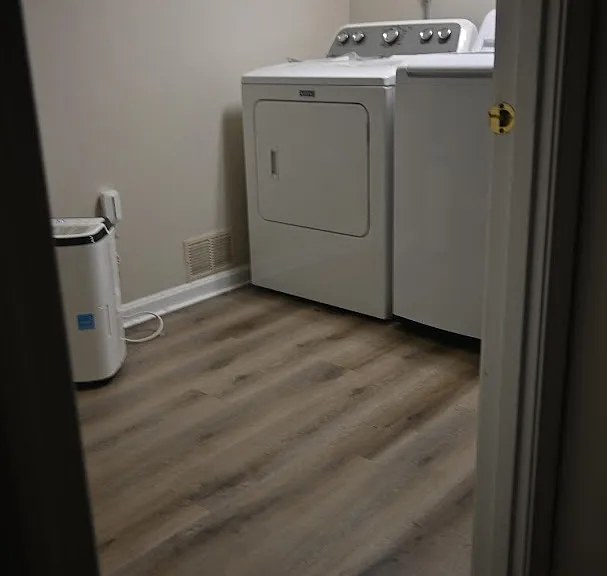 Separate laundry room with large sink