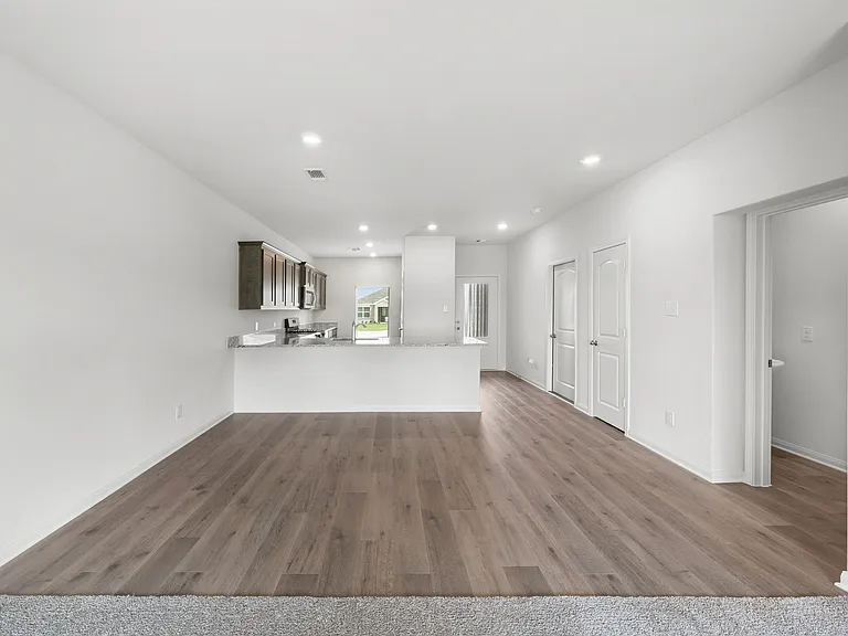 The dining room sits right off of the kitchen has a large window.