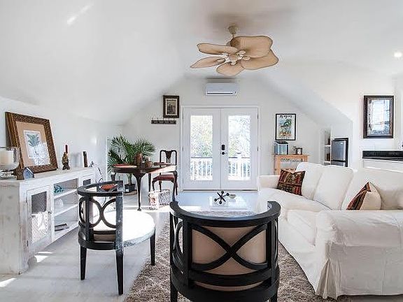 Living area has vaulted ceiling, 47 " flat screen TV, small bar area and storage area access for luggage,golf clubs,etc.