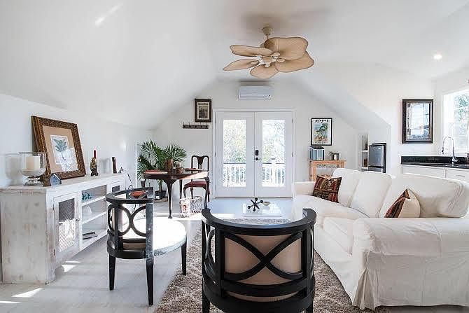 Living area has vaulted ceiling, 47 " flat screen TV, small bar area and storage area access for luggage,golf clubs,etc.