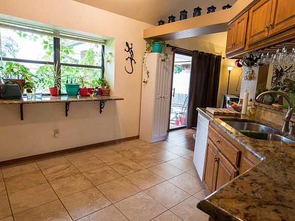 Bright, cheery kitchen with esquisite granite