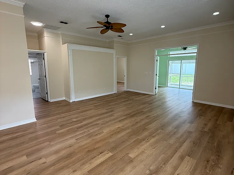 Large living area with brand new vinyl plank flooring