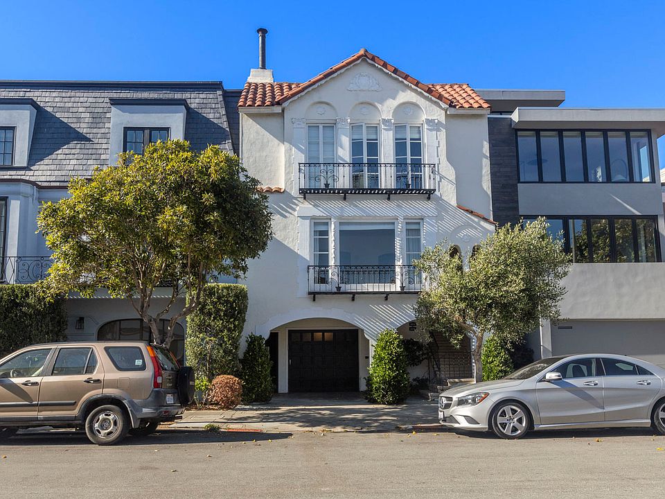 Front of house, unit is directly above the garage. Great light and beautiful olive tree in front. Location can't be beat!