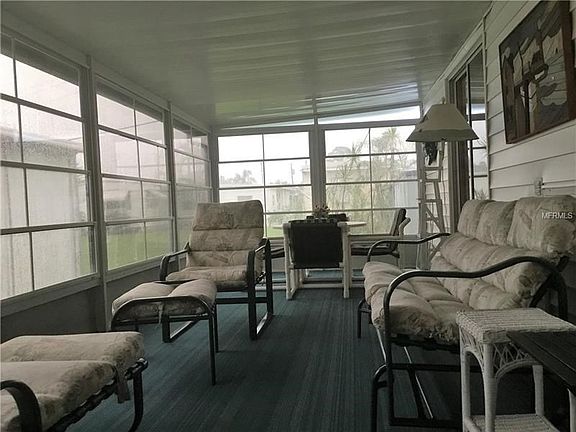Large Sun Room.  There is a living room, dining room and a sunroom in this spacious home.