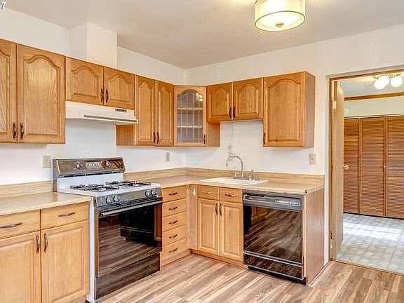 Kitchen with door open to the shared Laundry room