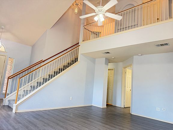Living room opens to the office and half bath downstairs.