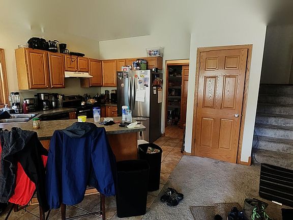 Large sunny living room. Main floor includes half bath and pantry behind kitchen