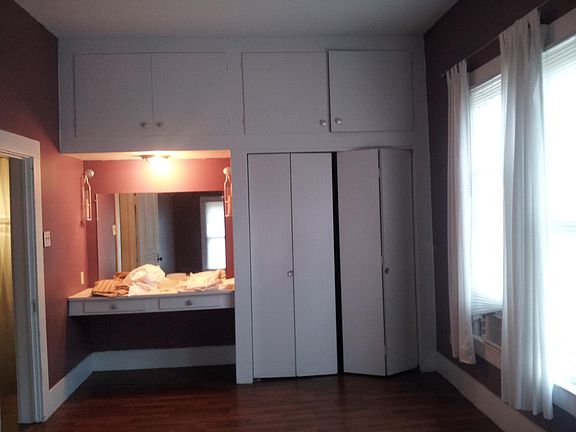 Vanity and closet in bedroom