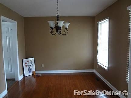 Living Room/Library
						:
						Office/Library/Living Room on first floor with two windows in front of house.