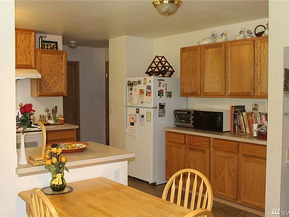 Extra kitchen storage and counter space.  In the foreground you see the eating area and to the right you can see a small built-in work desk. 