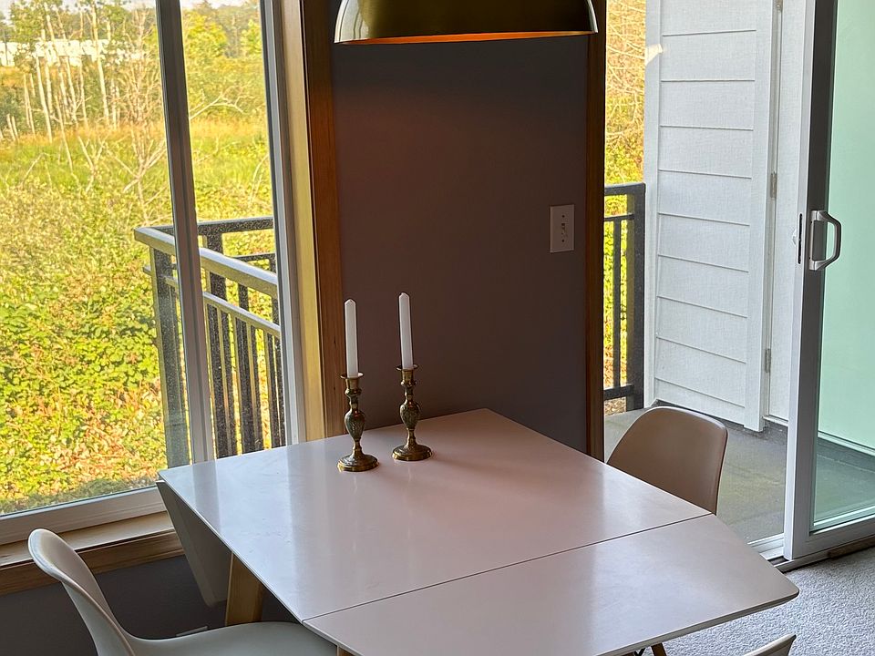Dining area with a large window.