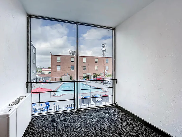 Peak 54 Apartments Hallway with View of Pool in Denver, Colorado