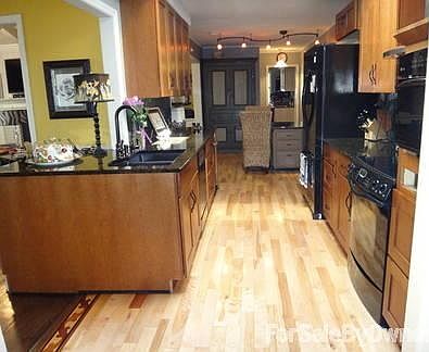 white birch floor with granite surfaces