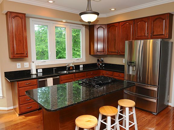 CHERRY CABINETS AND GRANITE 