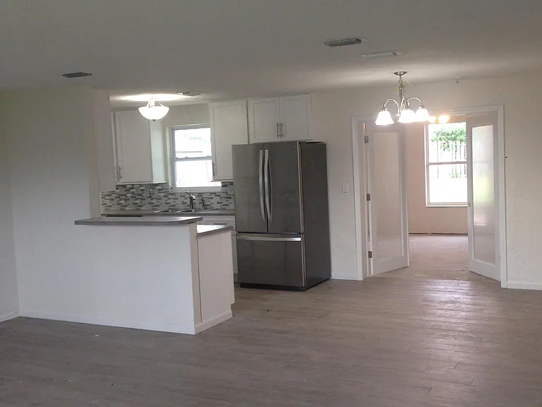 looking from living to kitchen seeing dinning area and famil