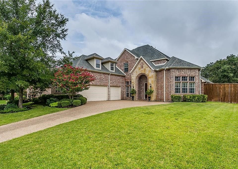 Stunning curb-appeal with lush landscaping!