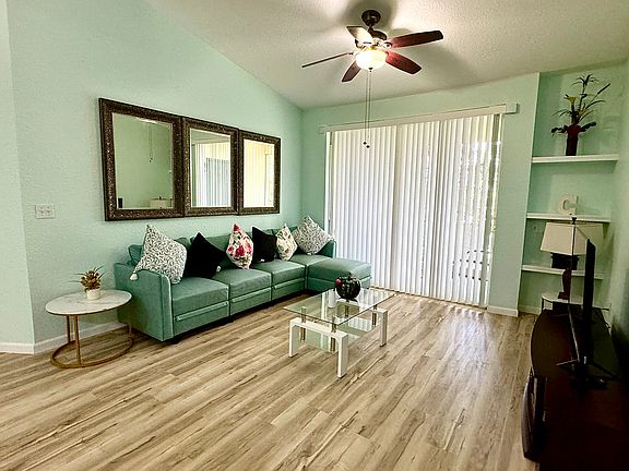 living room with TV and stander