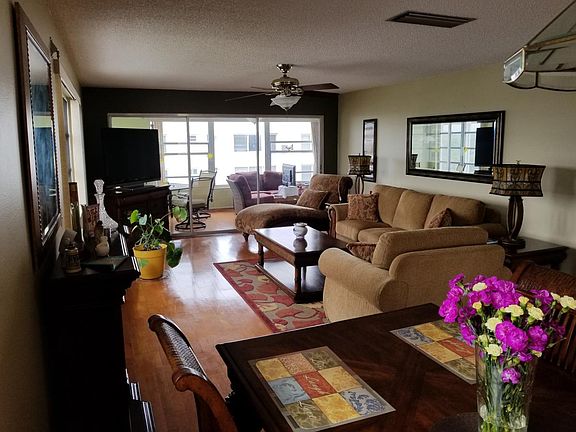 View Dining Room thru Living to Sun Room