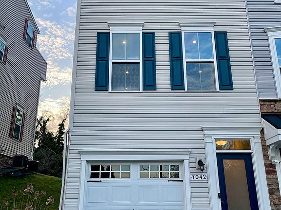 Clean and modern front elevation with private entry and attached 2-car tandem garage