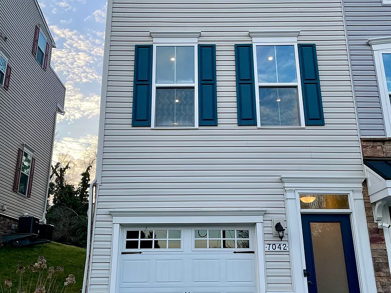 Clean and modern front elevation with private entry and attached 2-car tandem garage