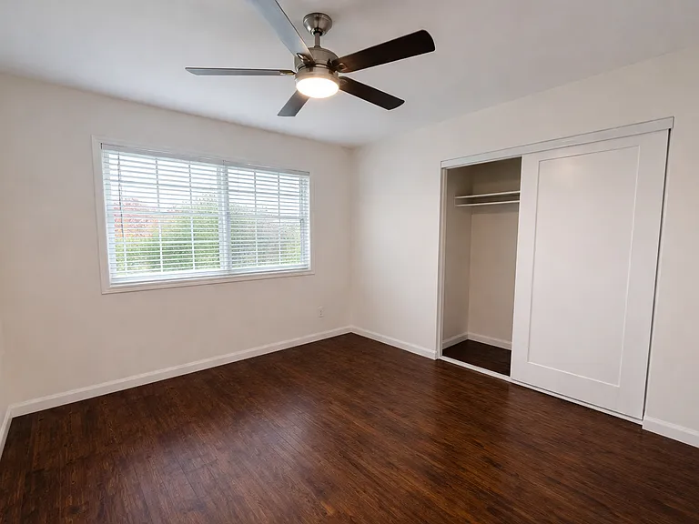 Newly remodel bedroom with closet and ceiling fan