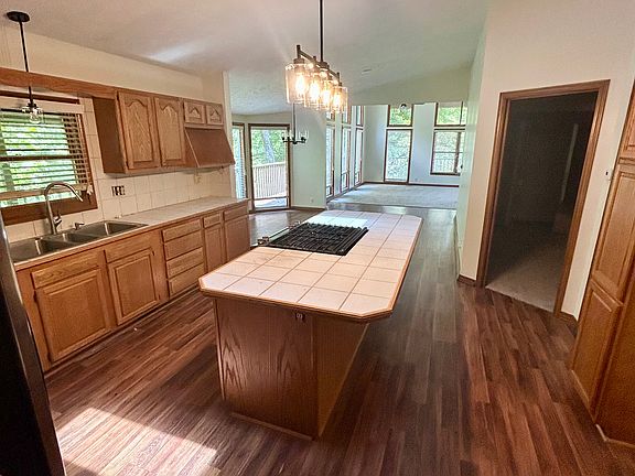 Large island is a great spot for a casual meal or conversation in the kitchen.