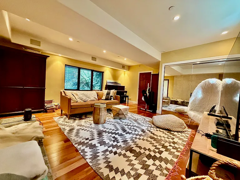 Large bedroom or family room on ground floor, to the right of the entry door. Lot of storage space and access to server room for whole house sound system and computer system (wiring is ready, tenant would have to set up if of interest).