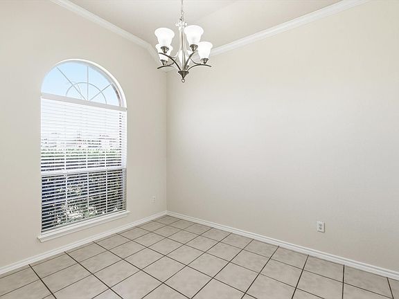 And here it is. The dining area. Tiled floor for easy cleaning. Large window, lots of light and entryway to the kitchen