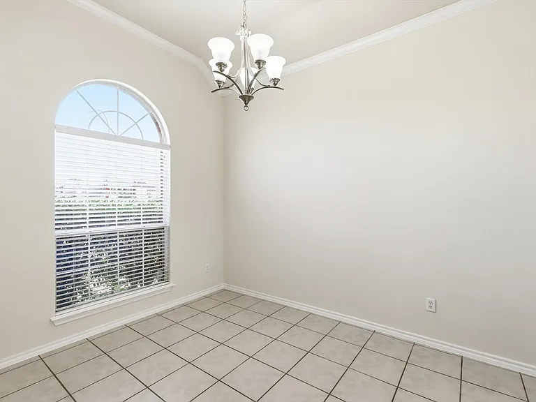 And here it is. The dining area. Tiled floor for easy cleaning. Large window, lots of light and entryway to the kitchen