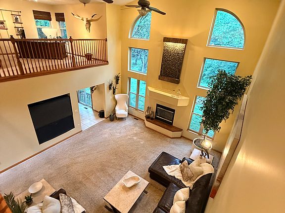Great Room with Wood Burning Fireplace - view from balcony on 2nd floor (just outside of Master Bedroom