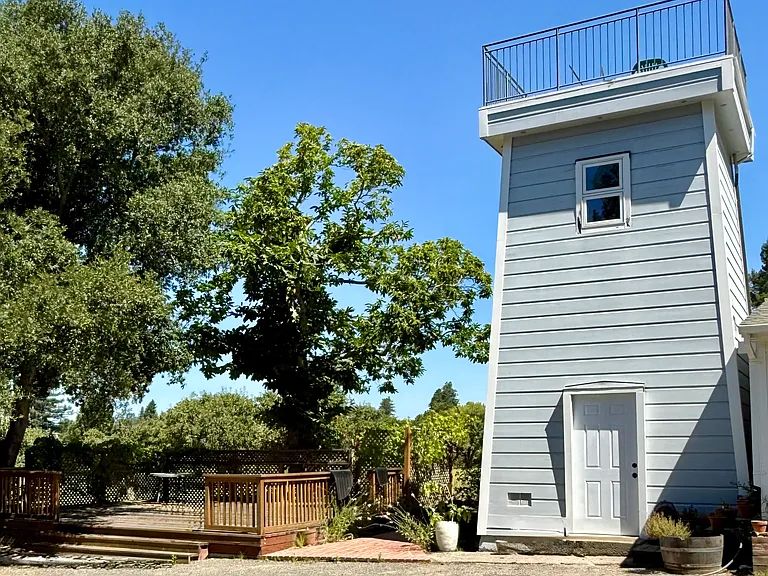 view of the outside deck and tower