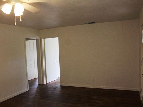 LIVING ROOM DOORS TO HALL AND SECOND BEDROOM